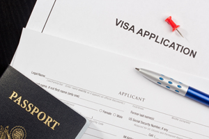 Visa application, pen and passport. 