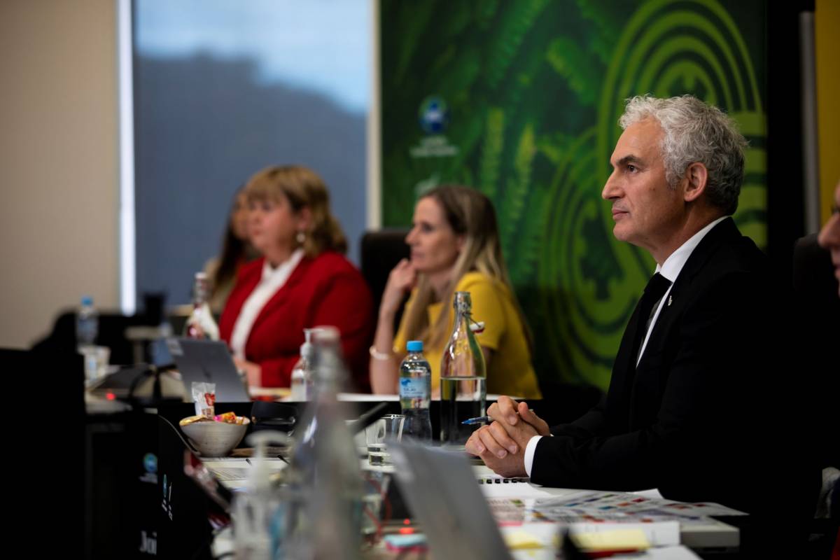 Behind the scenes of the APEC 2021 Small and Medium Enterprises Ministerial Meeting showing Minister Stuart Nash in the foreground.