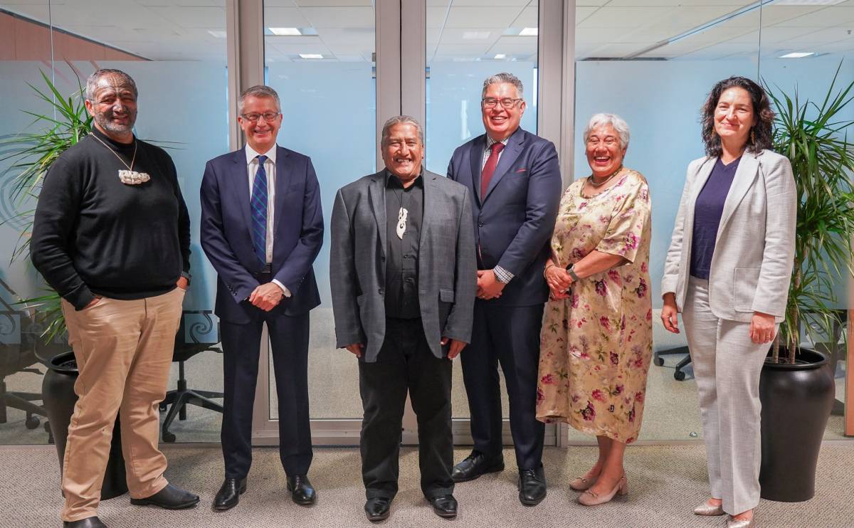 An image of people, posing for a picture. . 