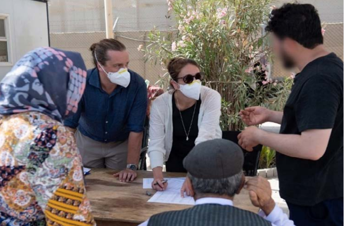 MFAT officials converse with recently evacuated Afghans at Al Minhad, United Arab Emirates..