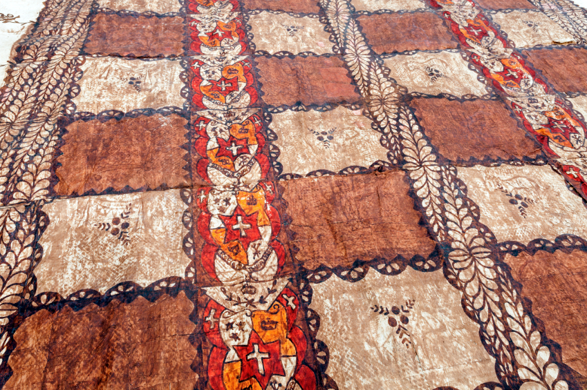 A tapas cloth on the ground.