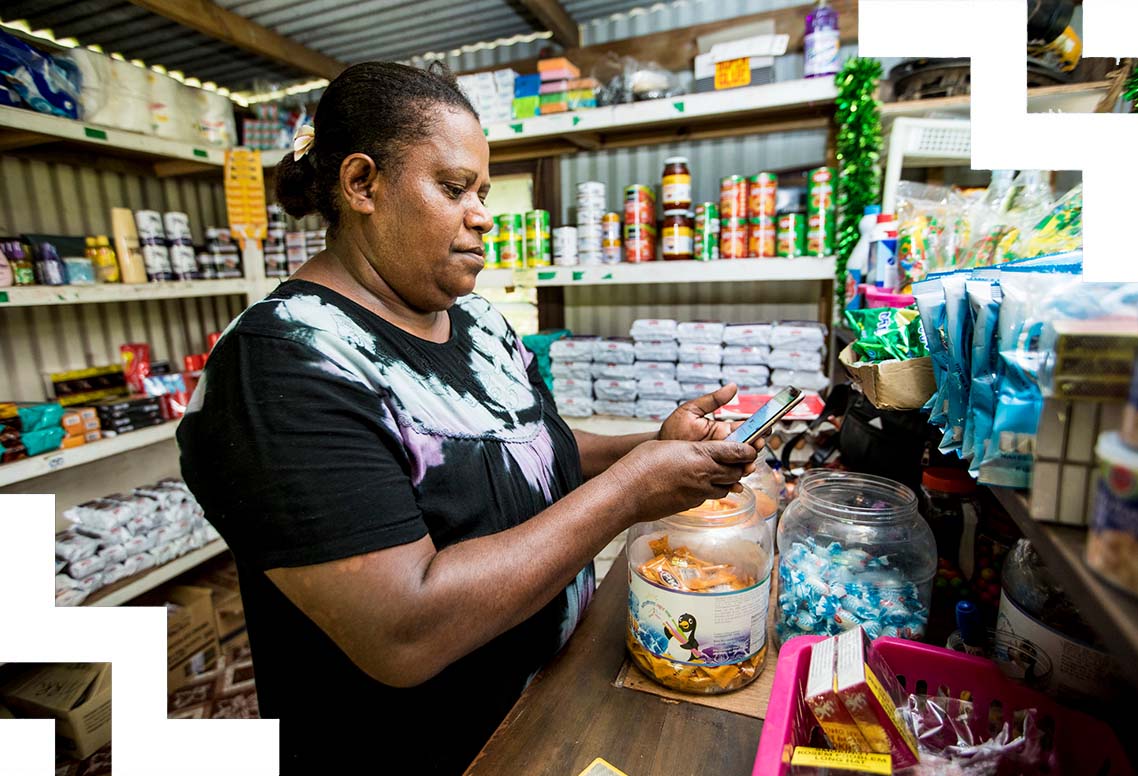 A woman serving in a shop. 
