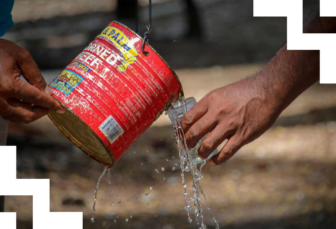 A watering can. 