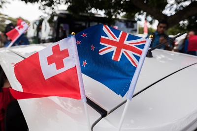 Flags of Tonga and New Zealand.