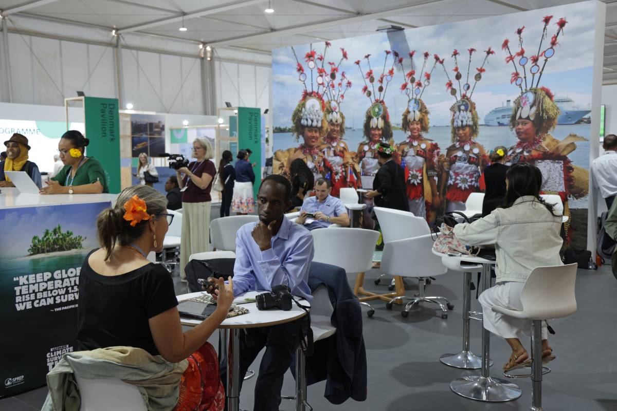 An image of people inside the Moana Blue Pacific Pavillion at COP27.