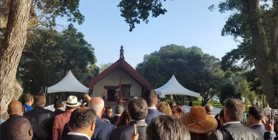 An image of a group of people at a Marae.. 