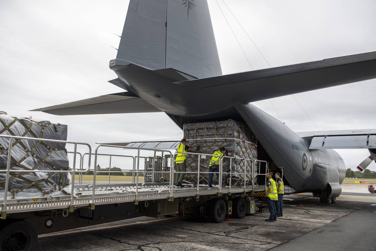 A Defence Force plane being loaded with supplies. 