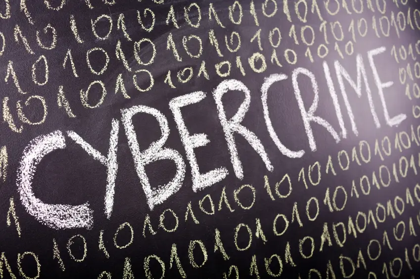 A blackboard with cyber crime written on it.