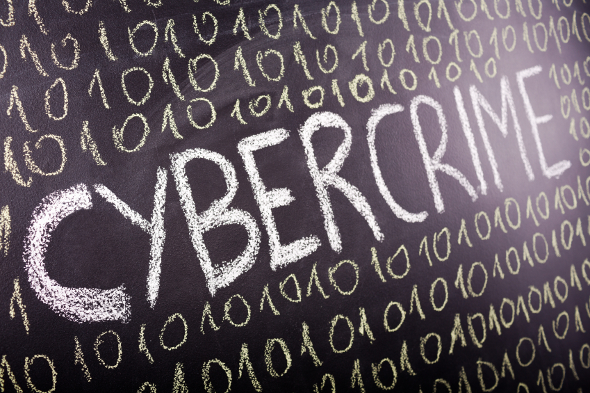 A blackboard with cyber crime written on it.