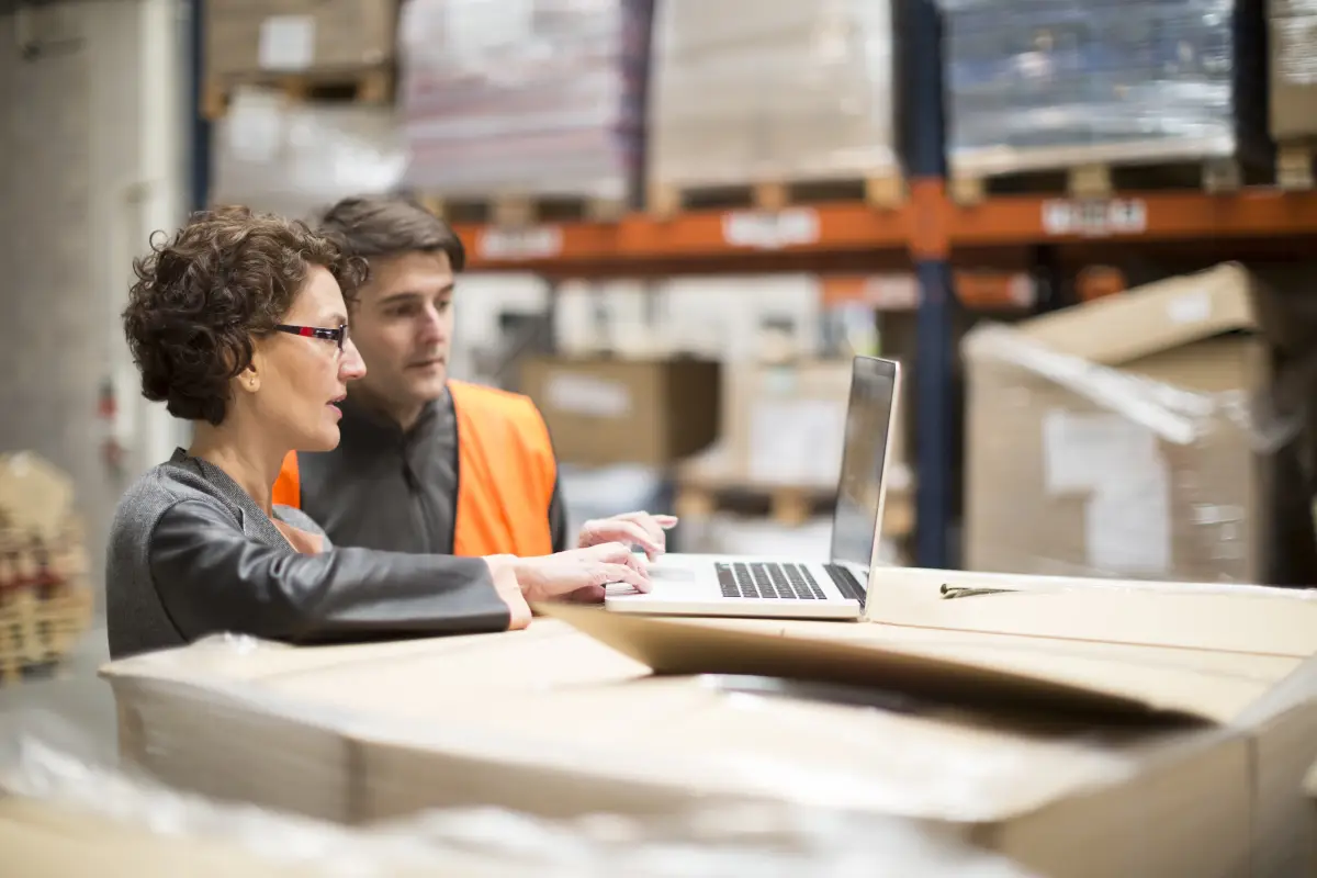 A woman working in a warehouse. 
